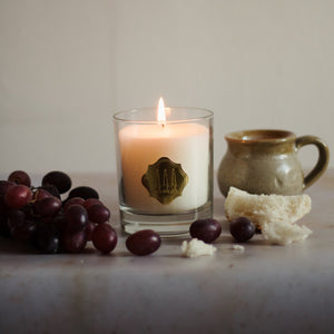 Bakehouse candle with bread and grapes